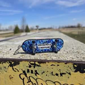 Indigenous Creature Beaded Skateboard Keychain